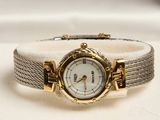a watch that is sitting on top of a white table