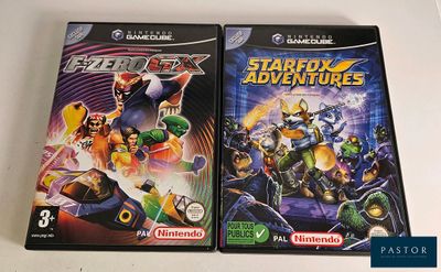 two video games that are sitting on a table