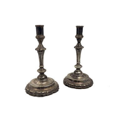 pair of silver plated candlesticks on stands