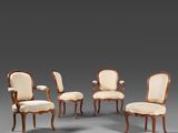 un ensemble de six fauteuils rembourrés en noyer, de style Louis II