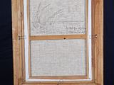 an old wooden easer with a drawing on it on a black background