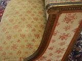 a chair that is sitting on a rug in a room