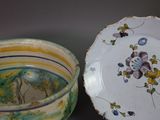a bowl and a plate sitting next to each other on a table