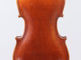 an antique violin with a wooden back and bow