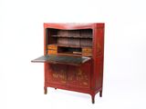 a small red cabinet with a book shelf on top of it
