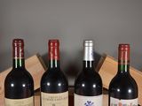 three bottles of wine are sitting in a wooden box