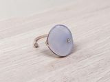 a close up of a ring on a wooden surface