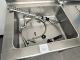 a sink that has a hose and a hose in it