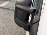 an image of a car ' s side view mirror on the side of the road