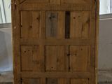 a wooden door with a window in the middle of it