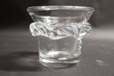 a glass cup with a handle on a table