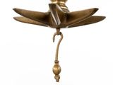 bronze figurine of a woman sitting on a lotus flower
