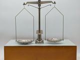 a scale with two plates on it on a table