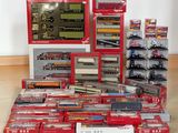 a lot of toy trains on display on the floor