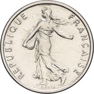 l'image d'une pièce d'argent représentant une femme tenant un panier