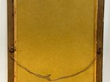 an old picture frame with a rope hanging from it ' s side