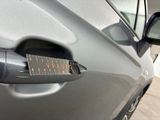 a close up of a car door handle with a sticker on it