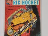 une vieille bande dessinée sur laquelle figure l'image d'un homme au volant d'une voiture jaune