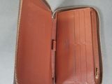 leather wallet with zippered closure and zippered closure on the inside
