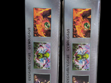 two boxes with pictures of cats on them on a black background