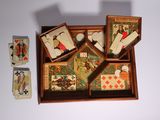 a wooden box with playing cards and a box of playing cards