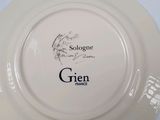 a white plate with a picture of a gien on it