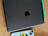 a laptop and an iphone sitting on a table