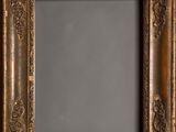 an old gold frame with a decorative pattern on it