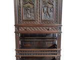 an old wooden bookcase with carvings on the front and sides
