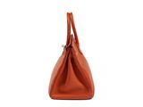a brown leather handbag on a white background