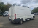 a white van that is parked in a parking lot