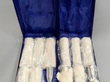 an open blue case filled with toothbrushes sitting on top of a table
