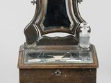 a small table with a mirror on top of it