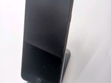 a cell phone that is sitting on top of a stand