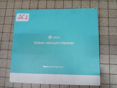 a box of robot vacuum cleaner sitting on top of a tiled floor
