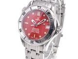 an image of a wrist watch with a red dial on a silver bracelet