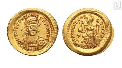 a gold coin with an image of a man and a woman on it