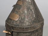 an old metal container with a tag on it