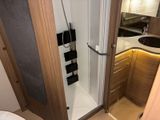a bathroom with a shower and a sink in it