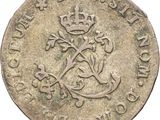 a close up of a coin with a crown on top of it