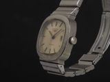 an image of a watch on a bracelet on a black background