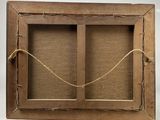 an old picture frame with a rope hanging from it ' s sides
