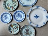 many plates and bowls on the floor on the floor