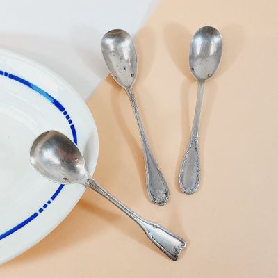 a plate with spoons and a plate with spoons and spoons on it