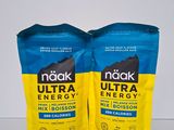 two bags of nutra energy drink sitting on top of a table