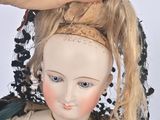 a doll that is sitting on top of a table