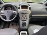 dashboard view of a car with a steering wheel and dashboard controls