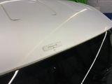 a close up of a car ' s hood with a sticker on it