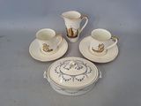 four cups and saucers sitting on a table