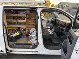 a white van that has a bunch of items inside of it